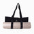 Bolso Laghu negro de Sukha Argentina, tamaño compacto y diseño elegante, con detalles en cuero y asa para llevar al hombro.