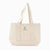 Bolso Laghu de Sukha Argentina, con diseño natural y detalles en cuero, exhibido en primer plano en color neutro.