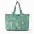 Bolso de terciopelo verde esmeralda Sukha Argentina, estilo compacto con asa y cierre metálico visible en la imagen.