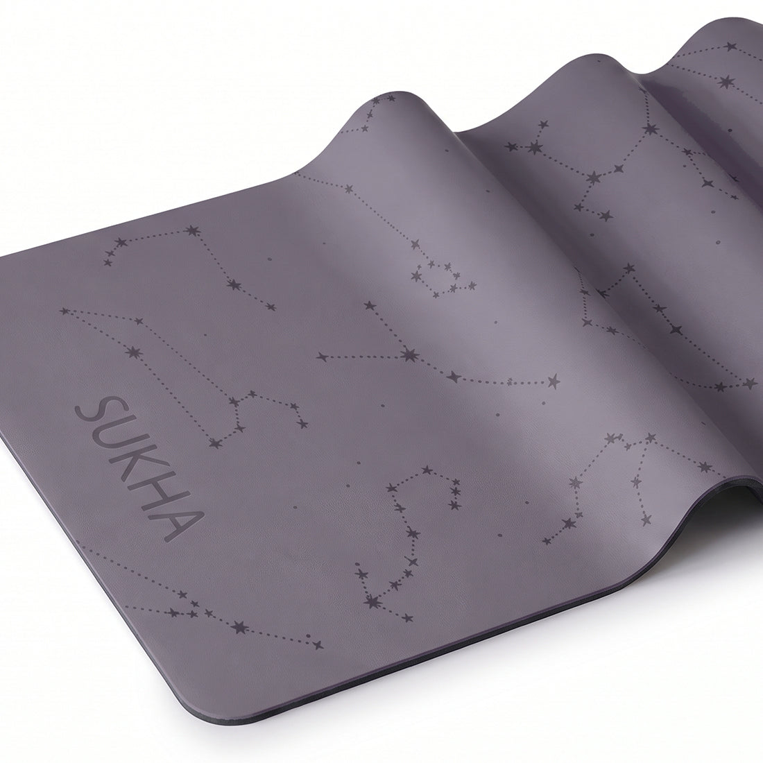 Esterilla de yoga Sukha Argentina DOT 5mm con diseño de puntos lilas, superficie antideslizante y acolchado para mayor comodidad.