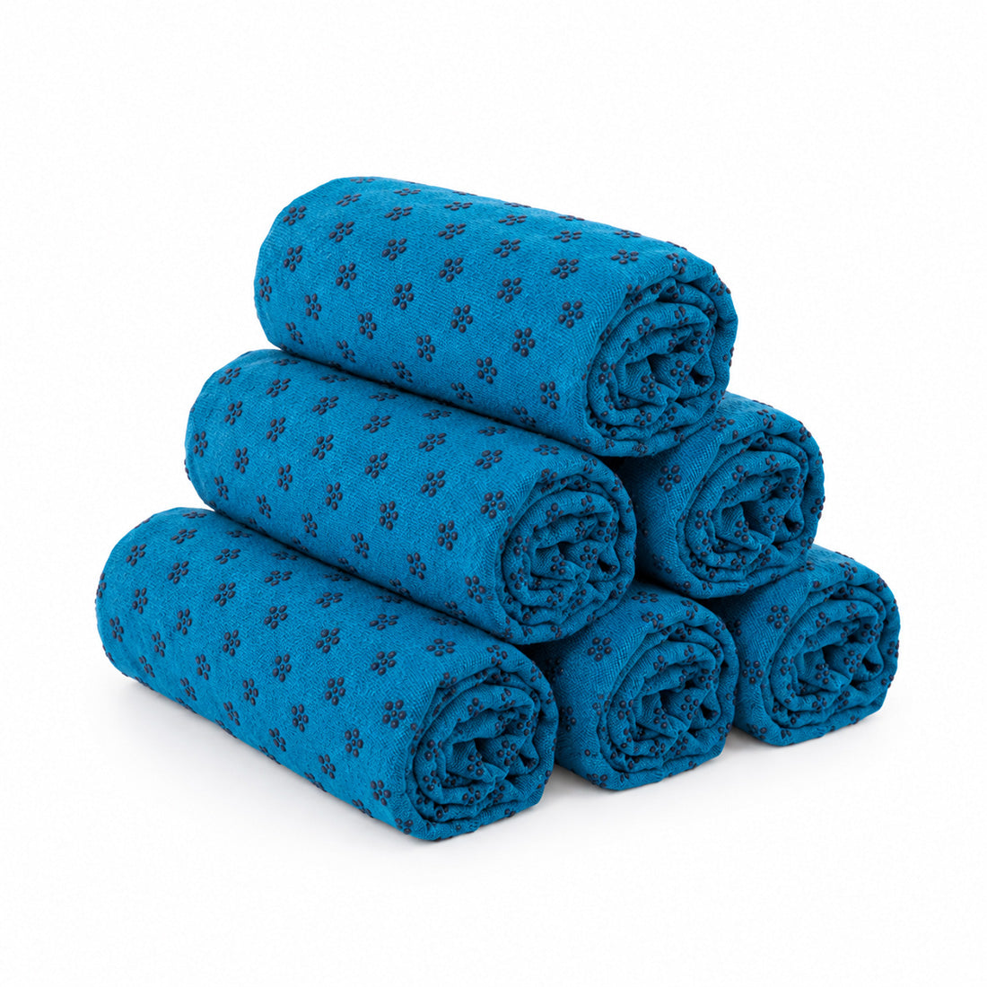 Toallas de yoga antideslizantes Sukha Argentina, paquete de 6, en color azul, sobre una mesa de trabajo.