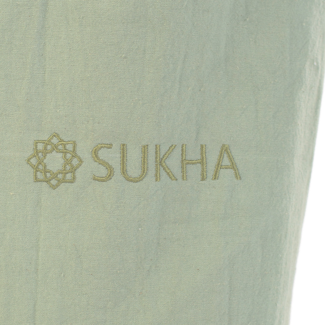Bolso portamaterial Sukha Argentina Portamat Shanti con algodón verde y detalles bordados, ideal para llevar objetos personales.